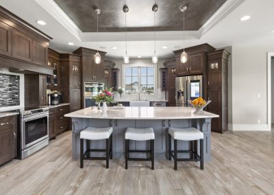 modern kitchen with island bar and dark brown cabinets